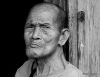 26 Old Man At A Wooden Wall in Black and White